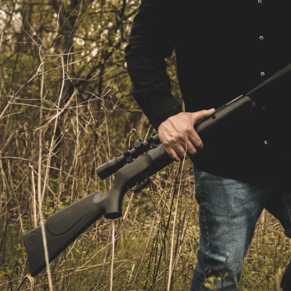 Benjamin Prowler NP (.22) BPSXS Outdoor Lifestyle Man Walking Through Field with Rifle Idle