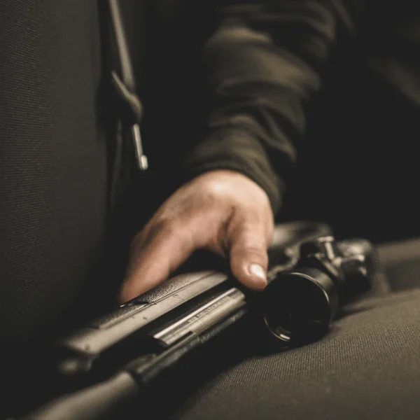 Benjamin Prowler NP (.22) BPSXS Outdoor Lifestyle Man Reaching Into Car to Grab Rifle