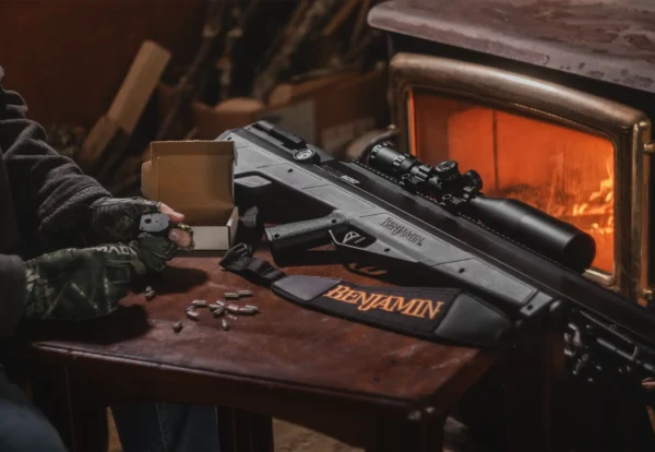 Benjamin Bulldog M257 BPBM2S Indoor Lifetsyle Magazine Being Loaded By Fireplace Rifle on Table WIDE VERSION