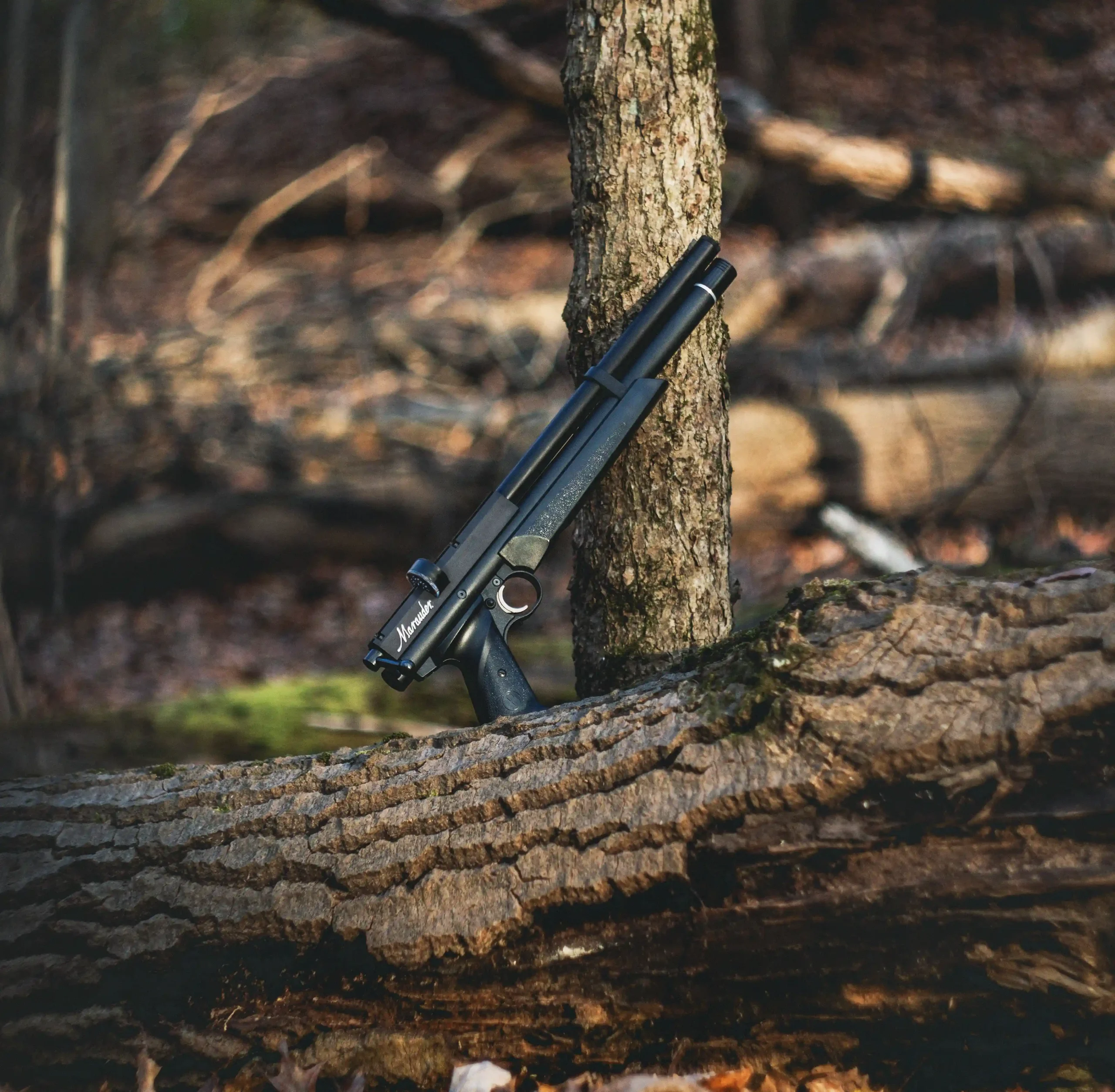 Benjamin Marauder Pistol BP2220 Lifestyle Leaning on Tree Outdoors Fall